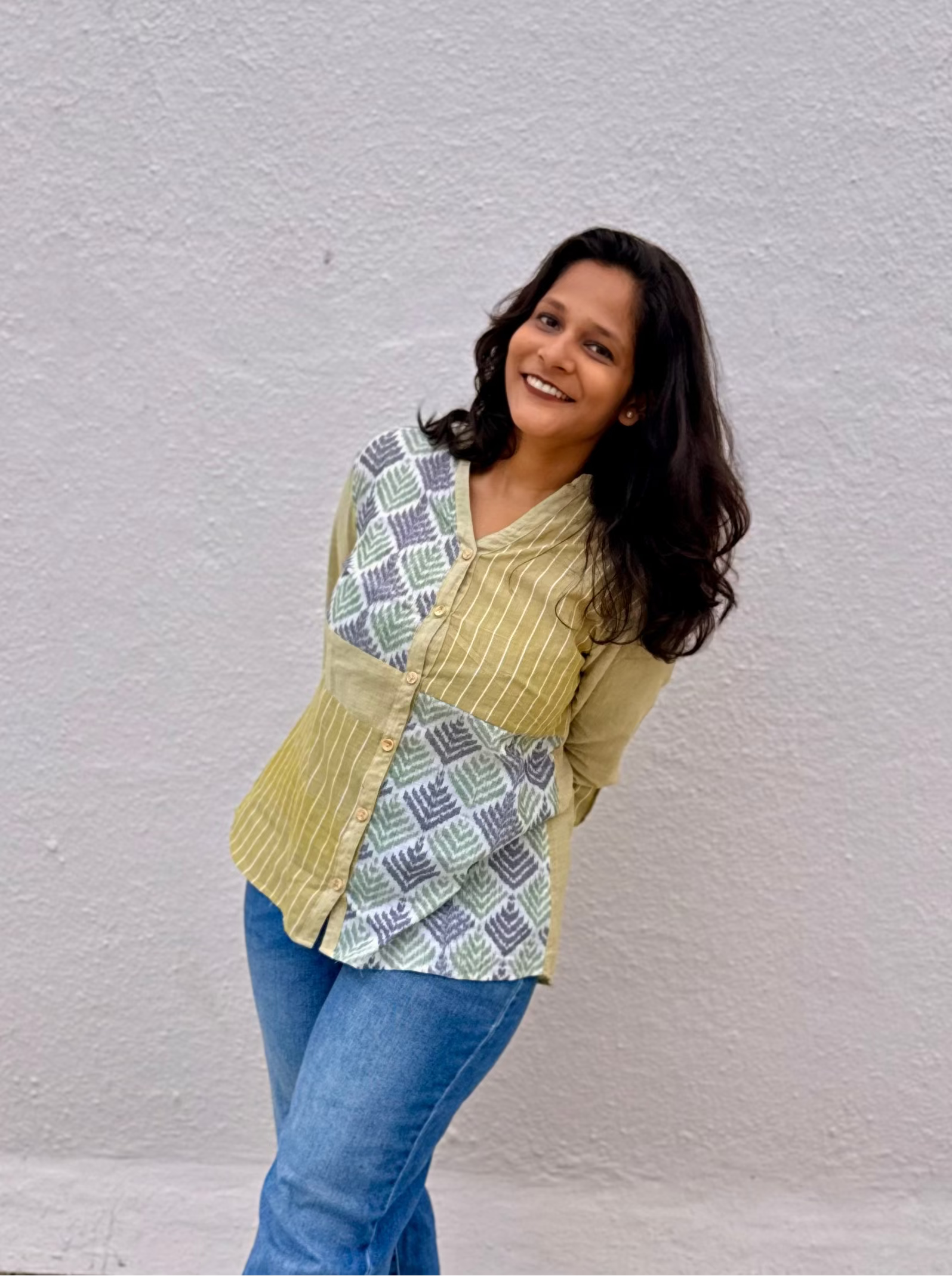 Saaj mustard handloom cotton shirt with contrast ikat panels, three-quarter front view