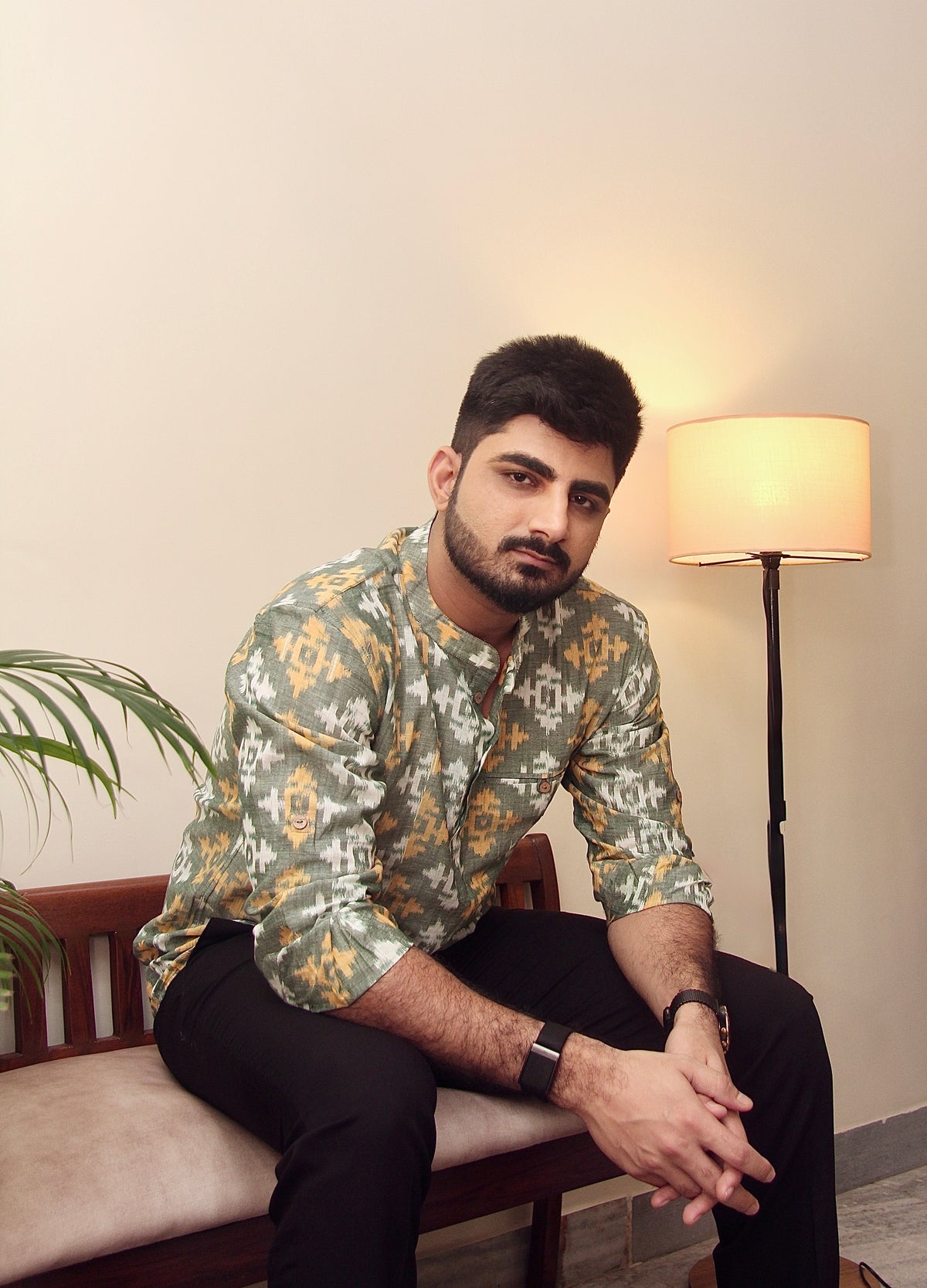 Mann Mauji sage green Sambalpuri ikat handloom kurta for men worn with black trousers, seated