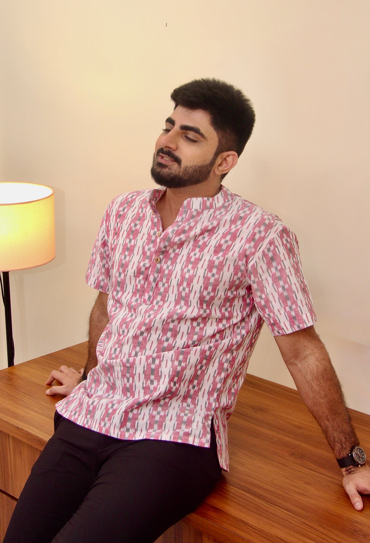 Safed Gulaab white and pink Sambalpuri ikat handloom kurta for men, seated view