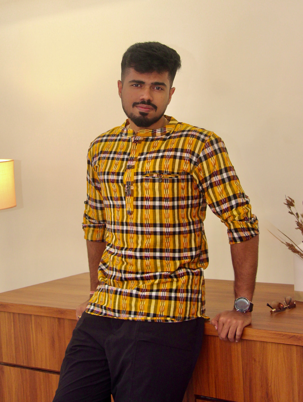 Kaali Peeli yellow and black checked Sambalpuri ikat handloom kurta for men worn with black trousers, front view