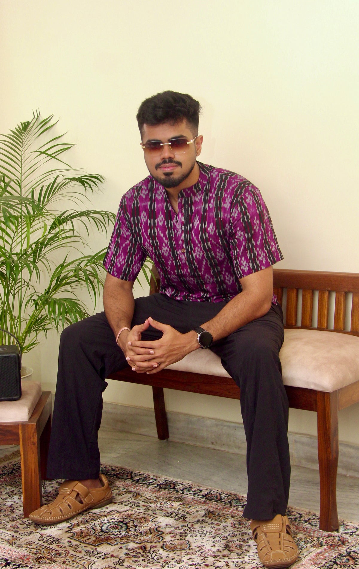 Kaala Jamun purple Sambalpuri ikat handloom kurta for men, seated three-quarter view