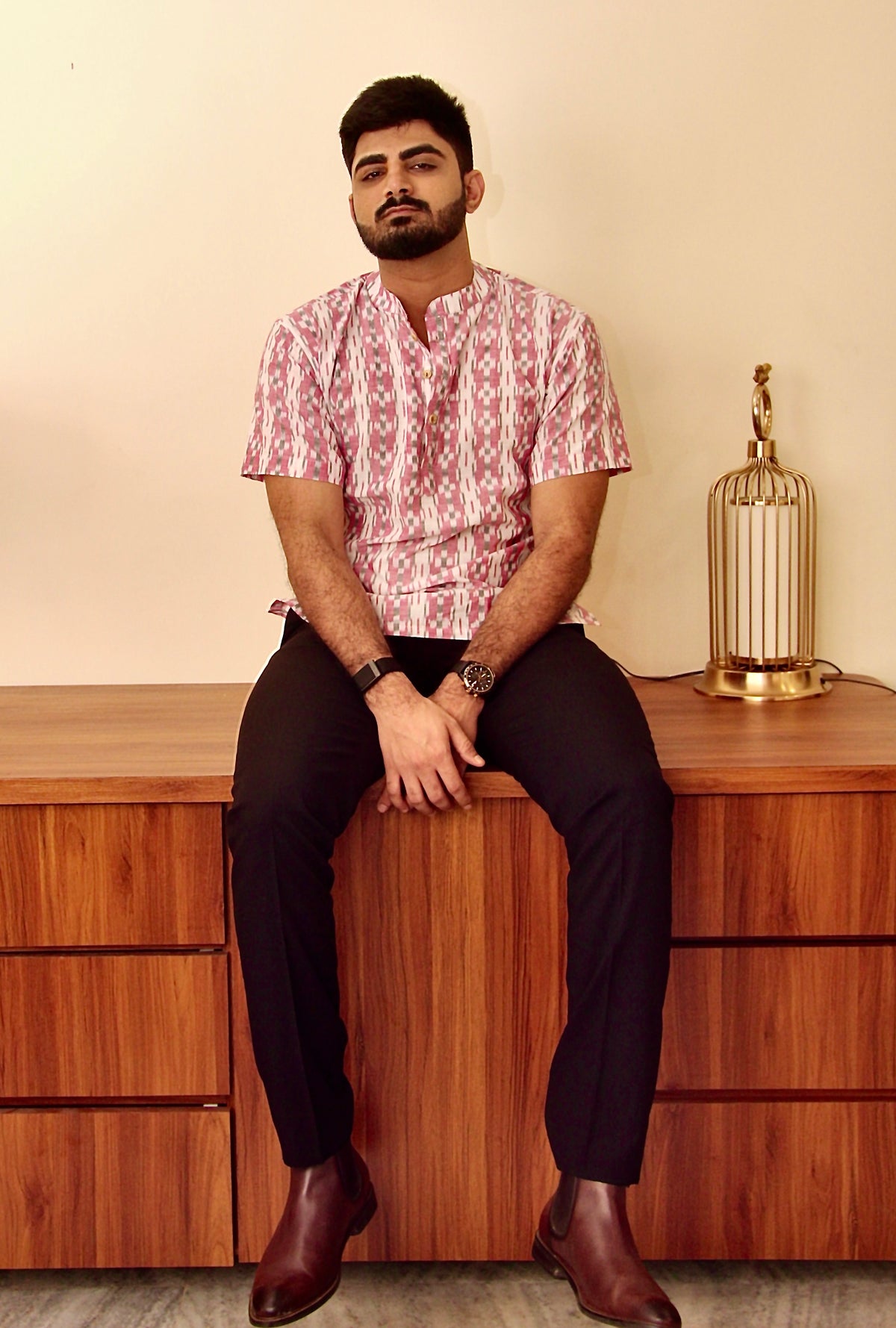 Safed Gulaab white and pink Sambalpuri ikat handloom kurta for men worn with black trousers, full length
