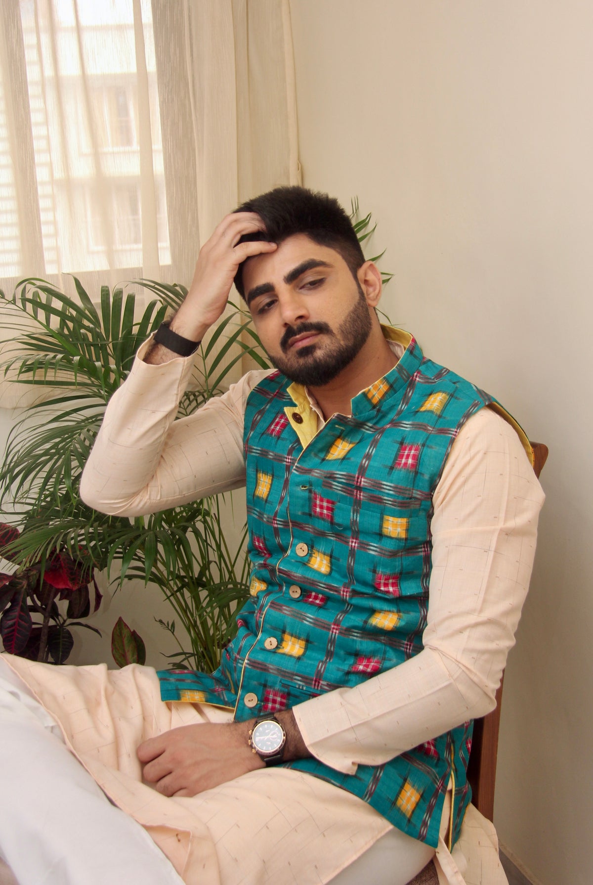 Kacchi Keri reversible handloom jacket for men, teal ikat side, standing view