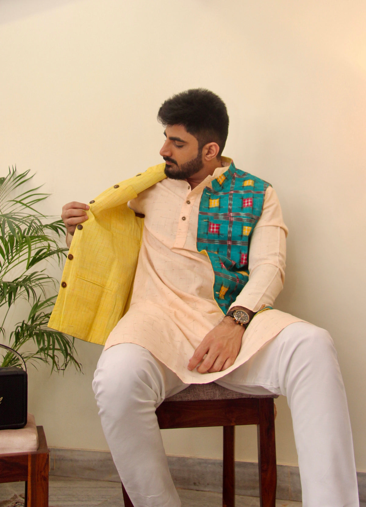 Kacchi Keri reversible handloom jacket for men, yellow reverse side shown with a cream kurta
