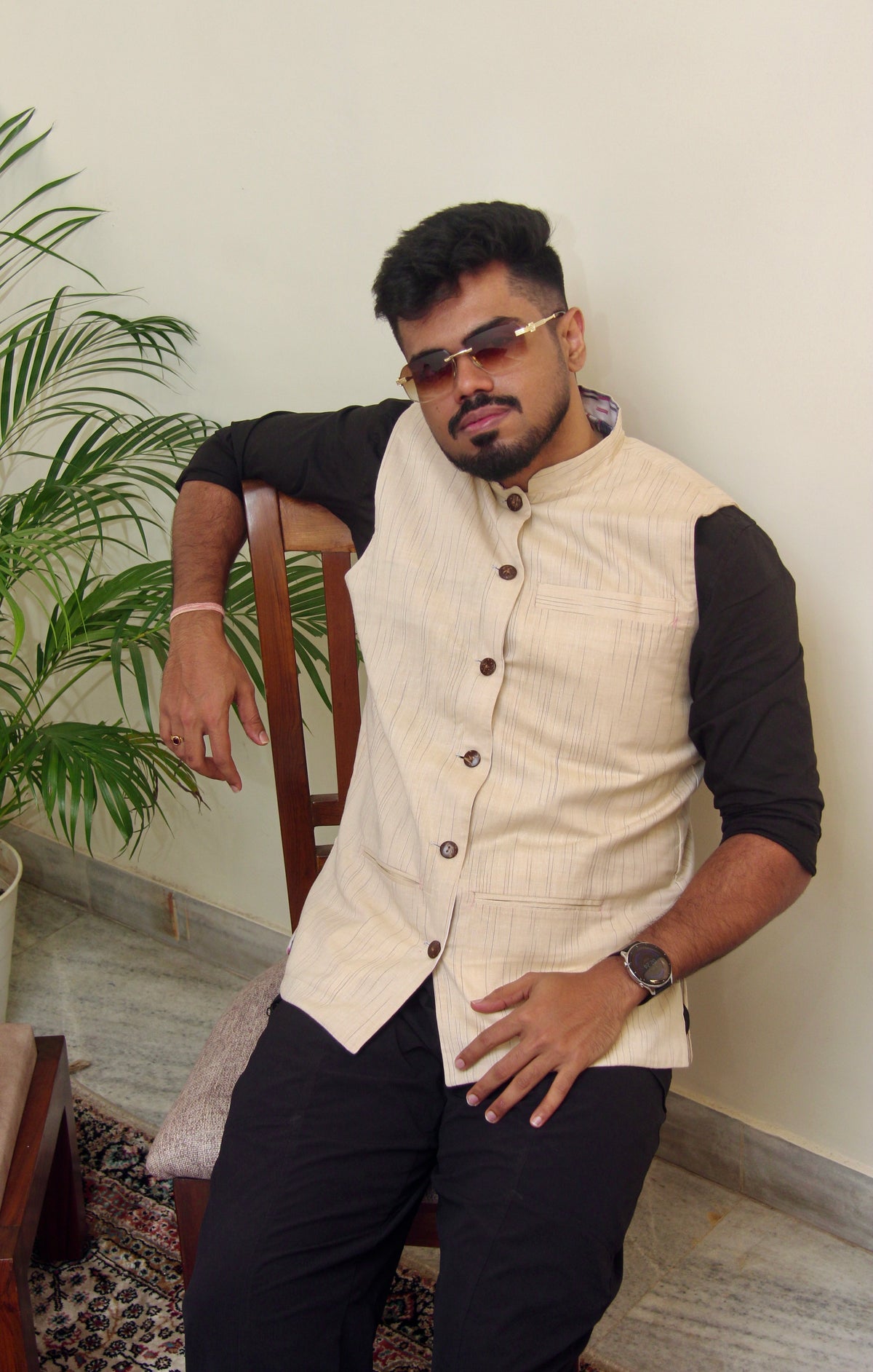 Sagar Kinaare reversible handloom jacket for men, cream reverse side worn over a black shirt, standing