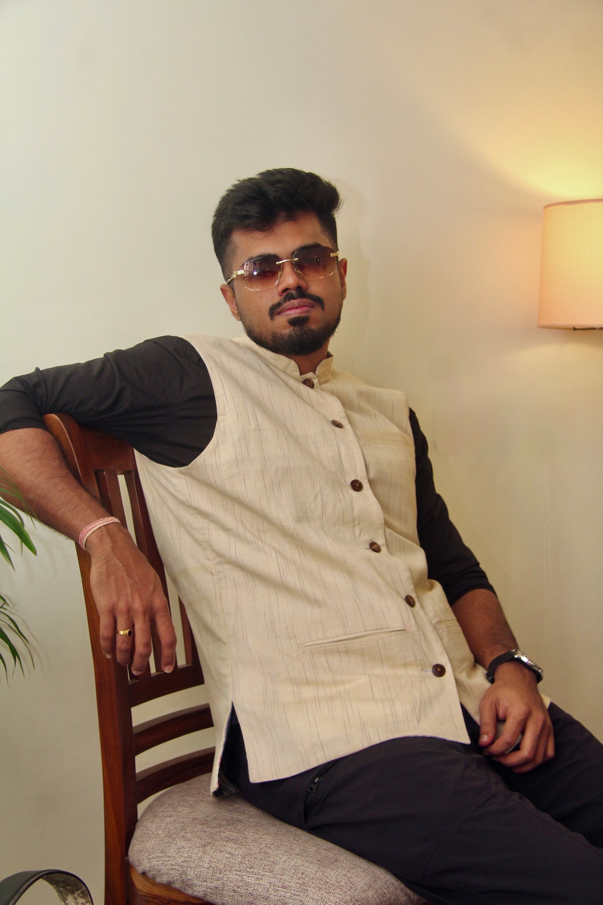 Sagar Kinaare reversible handloom jacket for men, cream reverse side, seated view