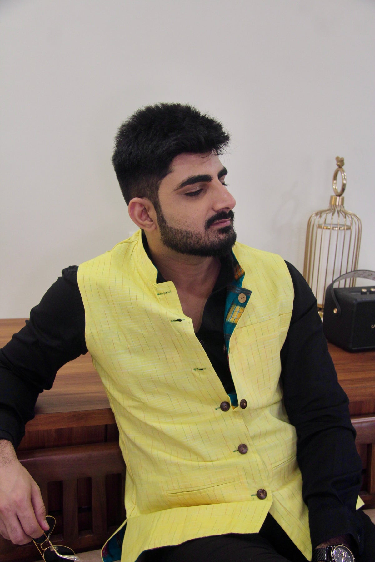 Kacchi Keri reversible handloom jacket for men, yellow reverse side worn over a black shirt