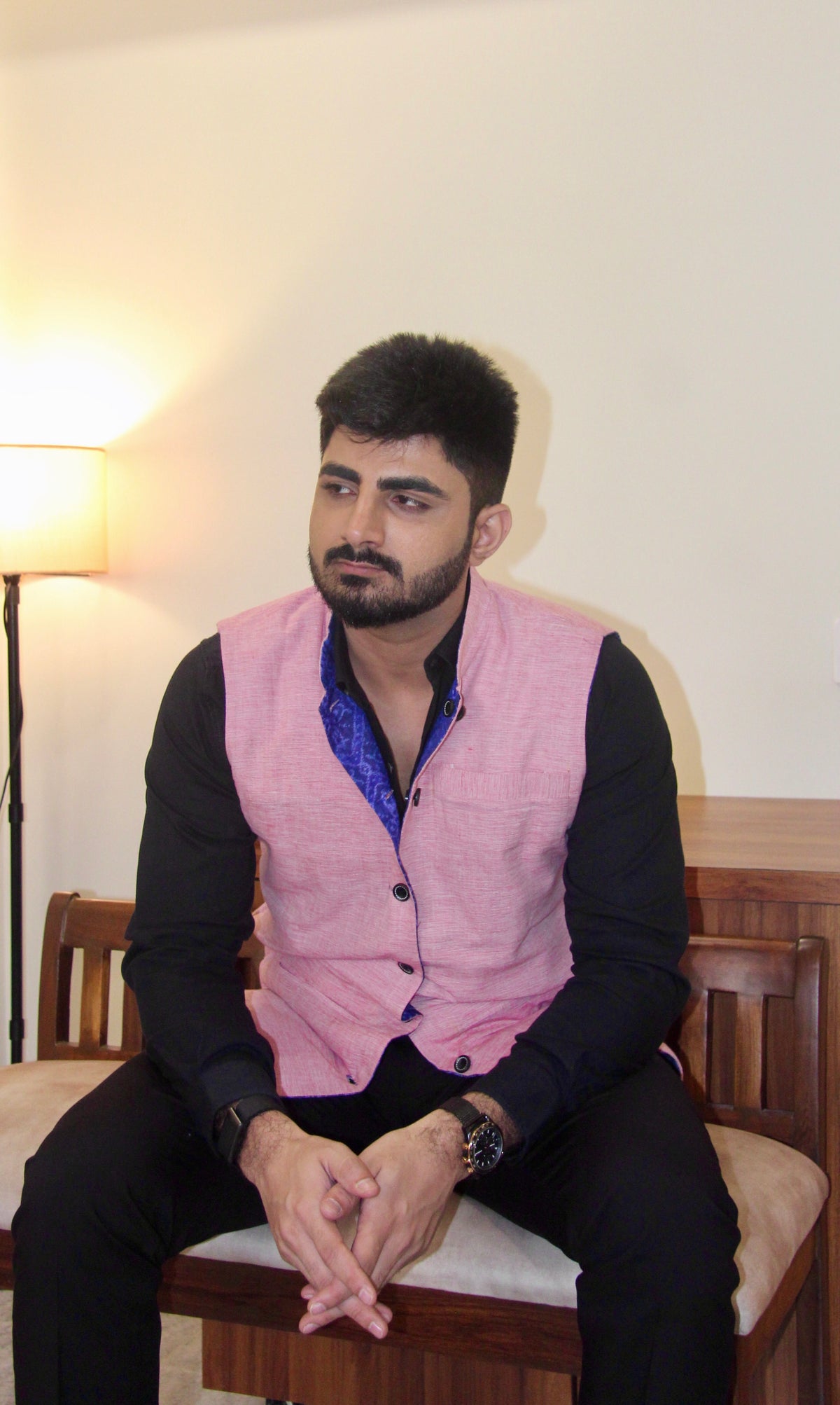 Shaam Savera reversible handloom jacket for men, pink reverse side worn over a black shirt
