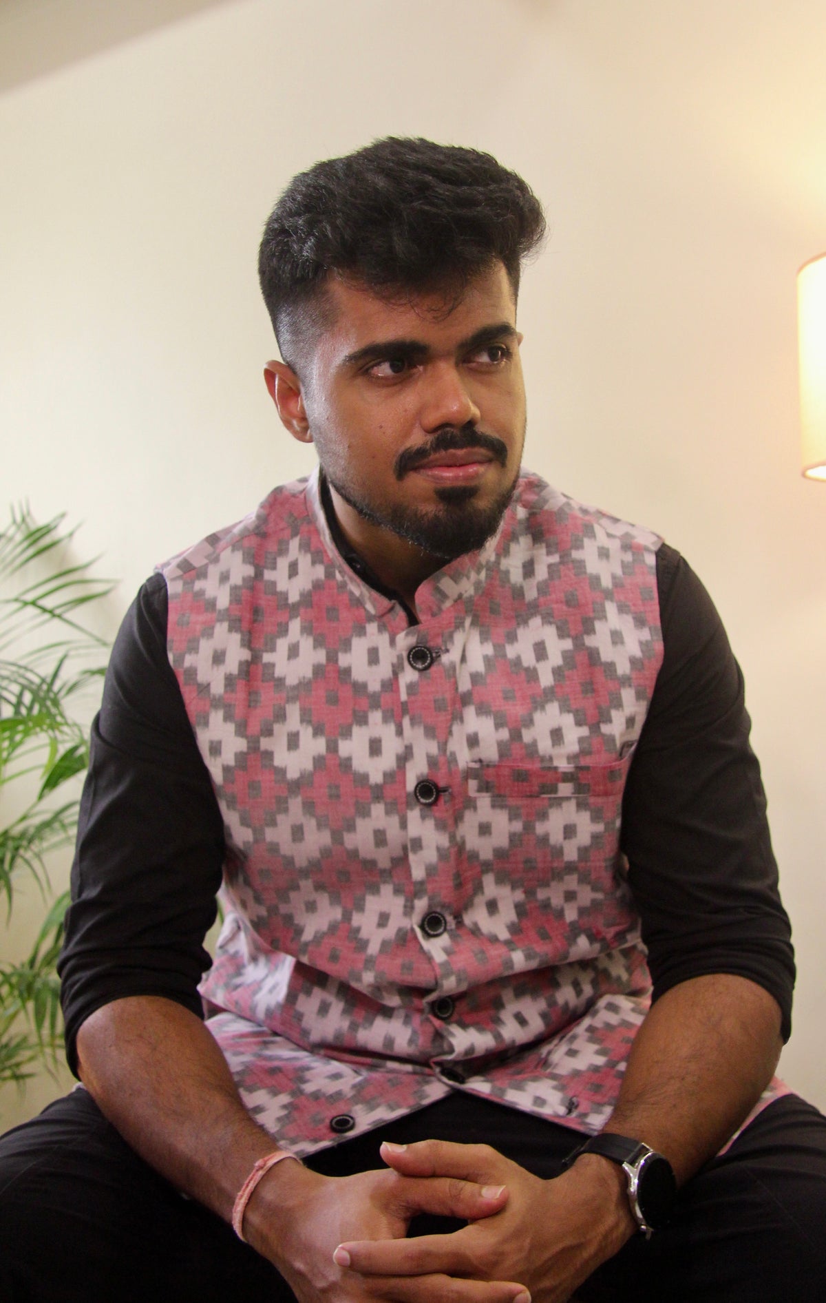 Do Dil reversible handloom jacket for men, pink ikat side, seated front view
