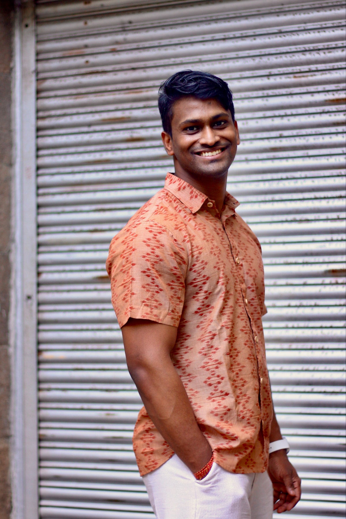 Kora terracotta Nuapatna ikat handloom shirt for men, three-quarter front view