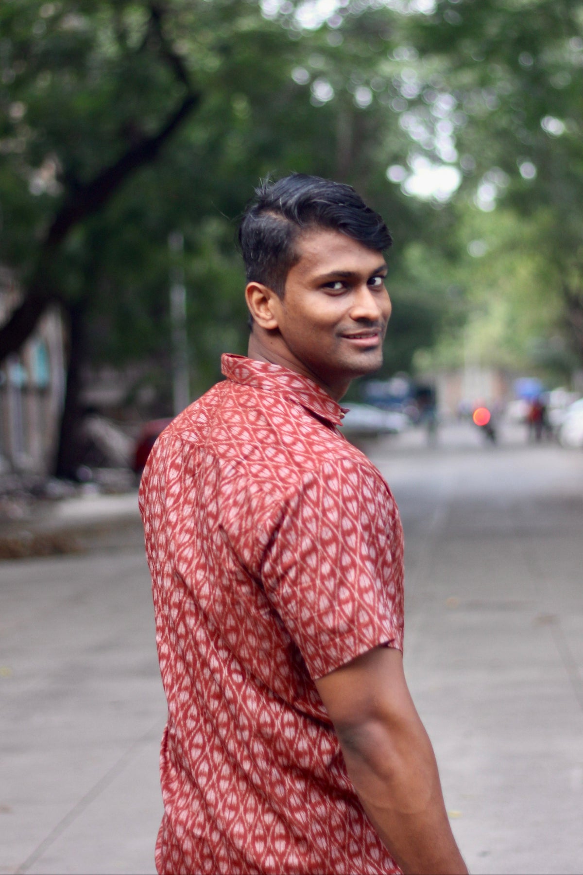 Maati brick red Nuapatna ikat handloom shirt for men, three-quarter view