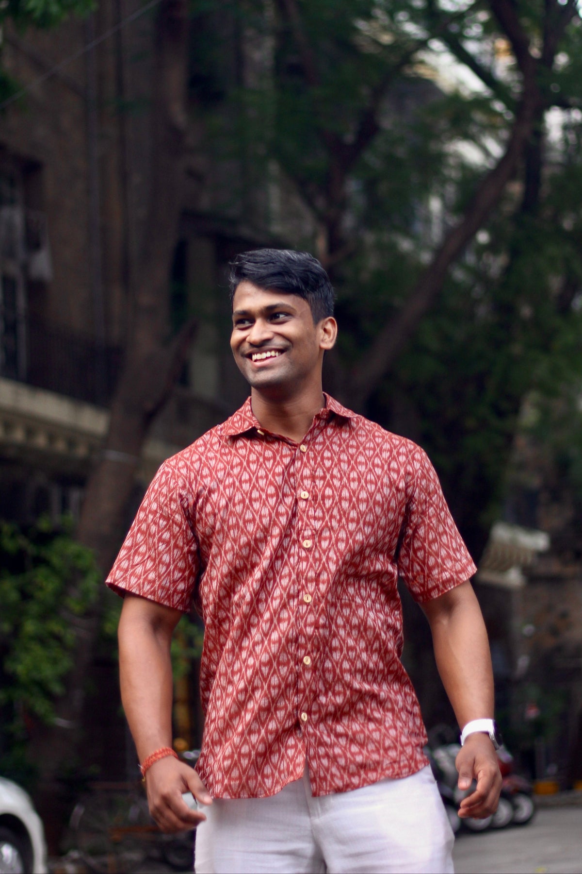 Maati brick red Nuapatna ikat handloom shirt for men, standing front view