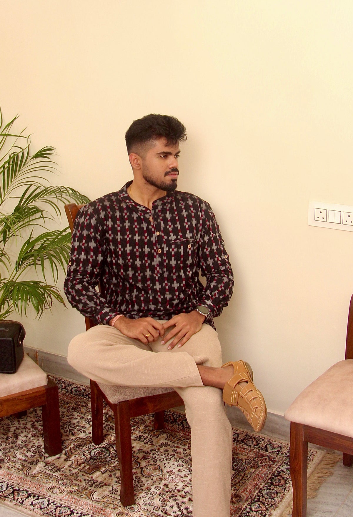 Aankh Micholi dark brown Sambalpuri ikat handloom kurta for men, seated front view
