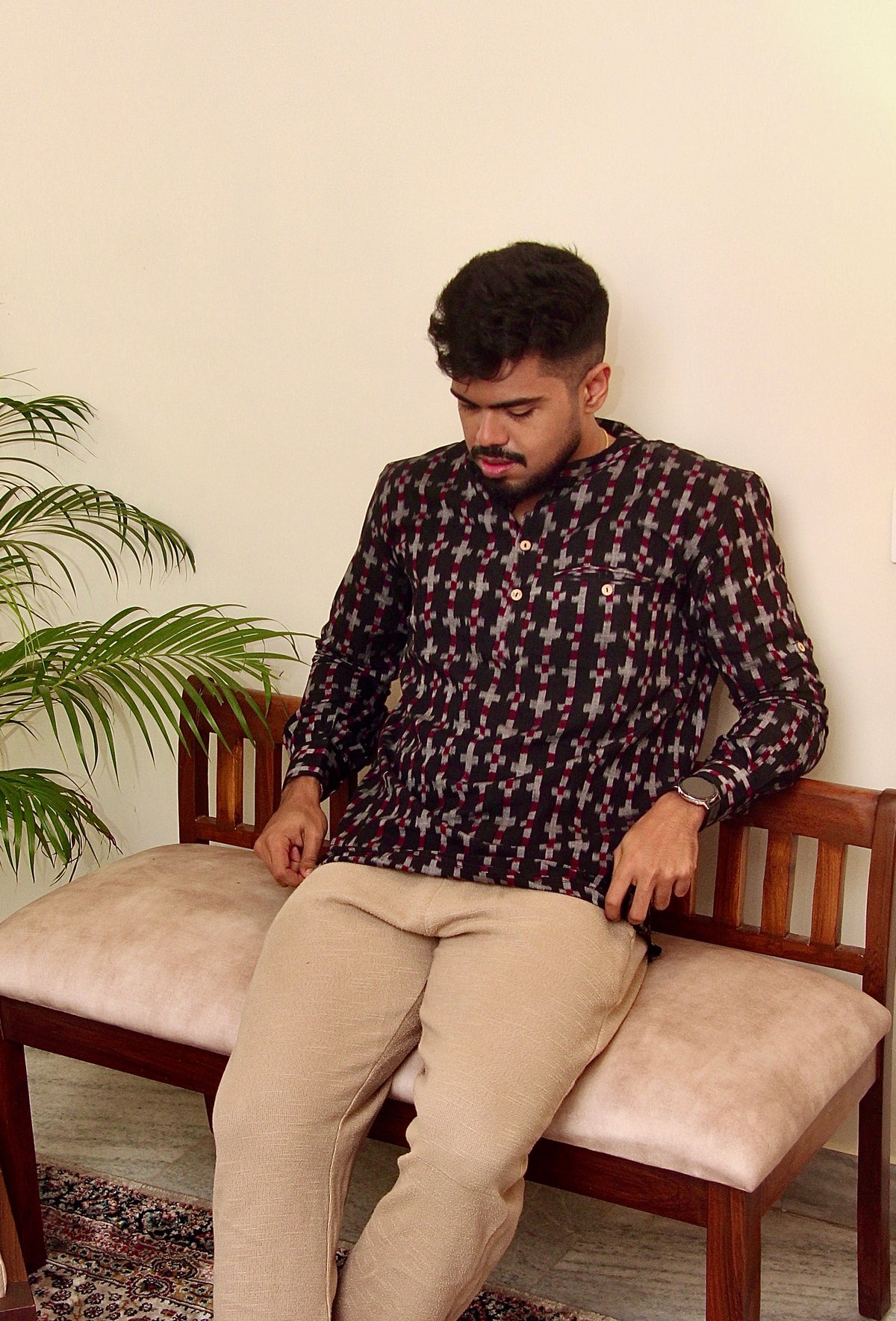 Aankh Micholi dark brown Sambalpuri ikat handloom kurta for men, seated front view