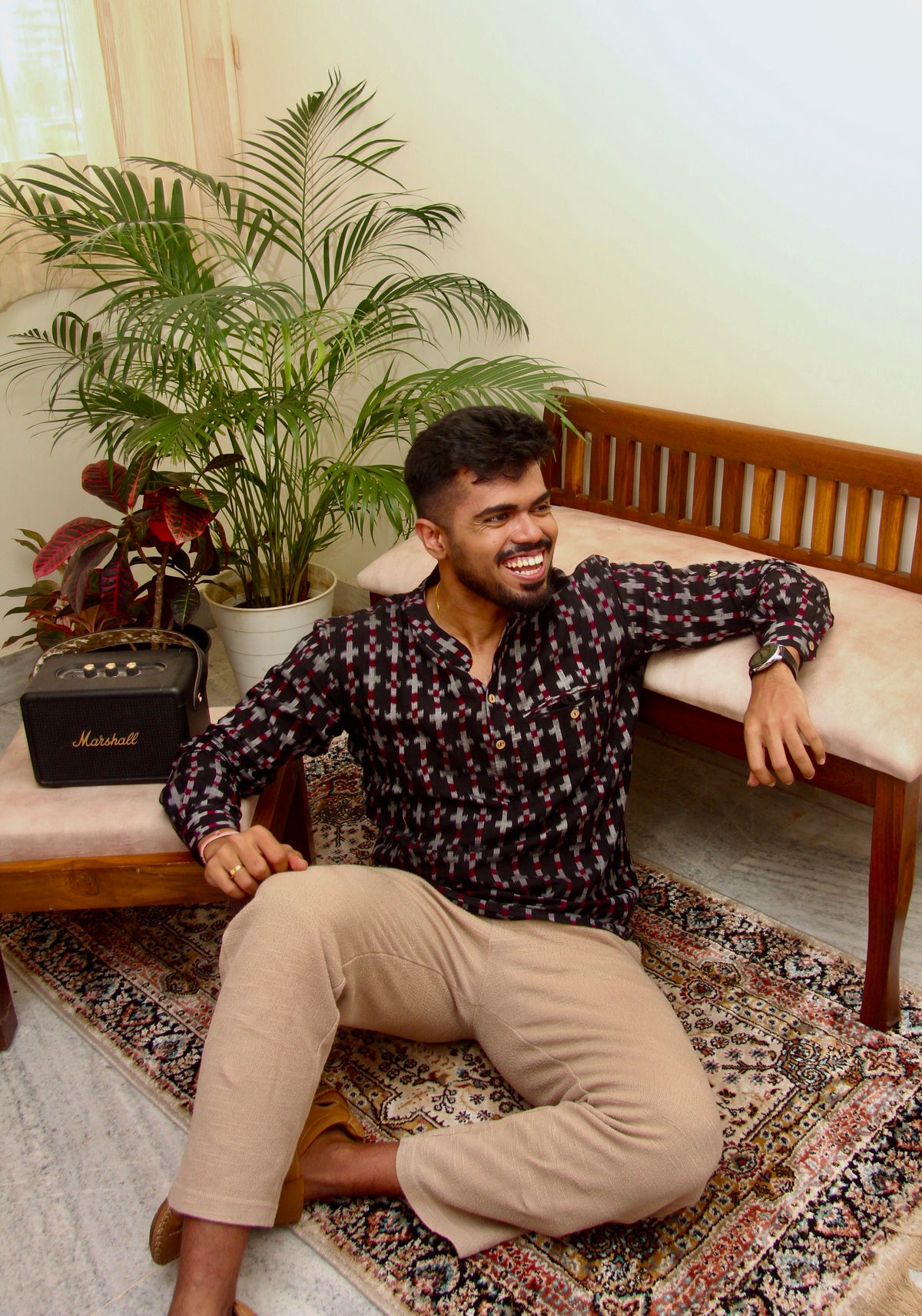 Aankh Micholi dark brown Sambalpuri ikat handloom kurta for men, seated three-quarter view