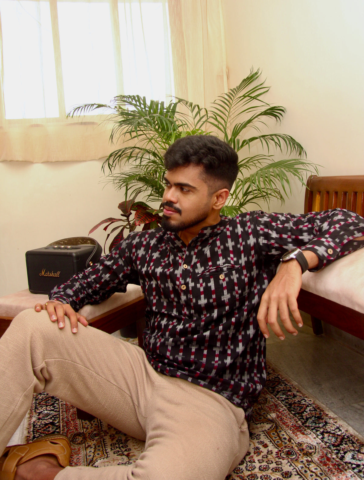 Aankh Micholi dark brown Sambalpuri ikat handloom kurta for men worn with beige trousers, seated