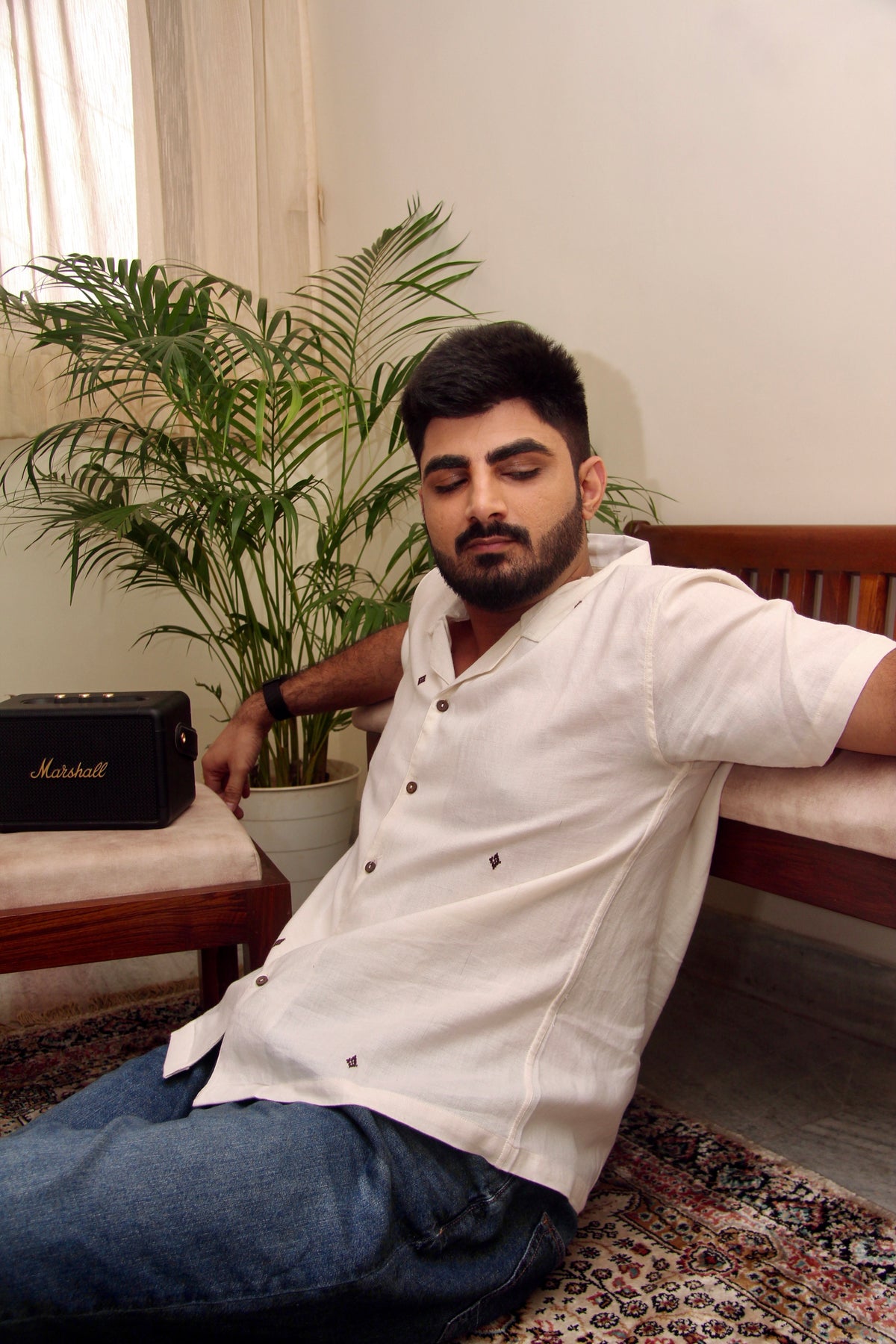 Shwet off-white Kotpad handloom shirt for men worn with jeans, front view