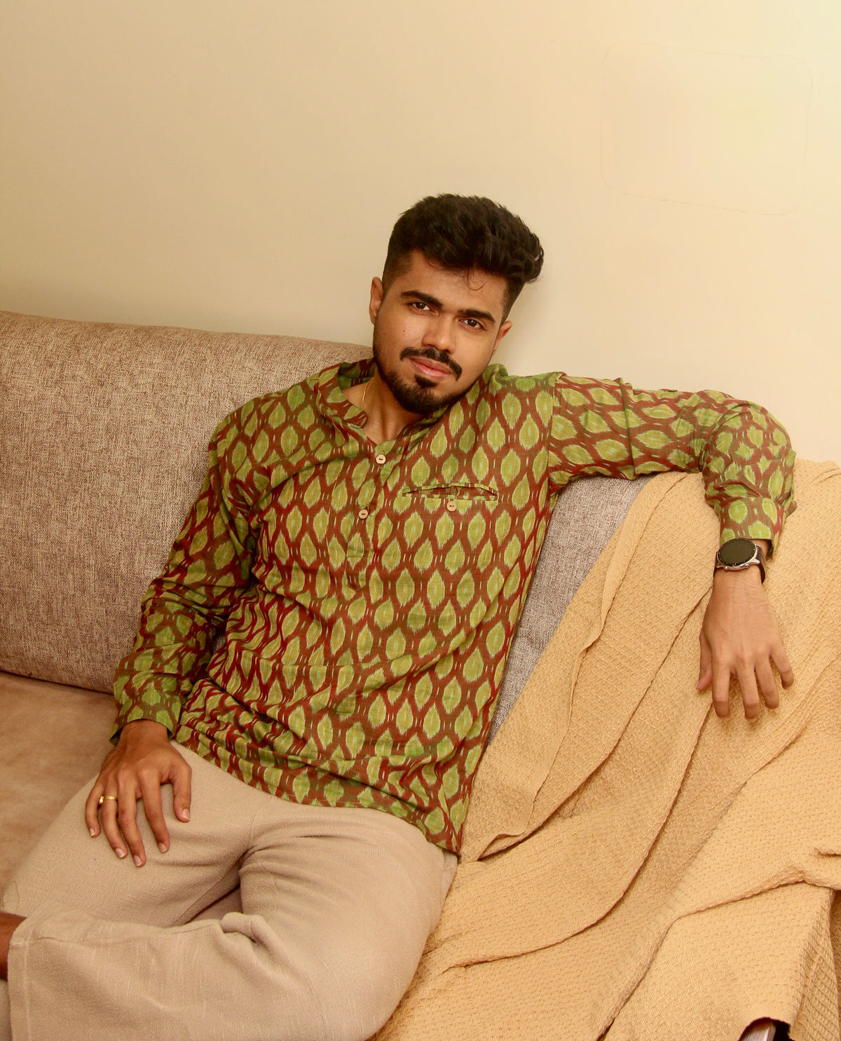 Aam Panna olive green Sambalpuri ikat handloom kurta for men, seated front view