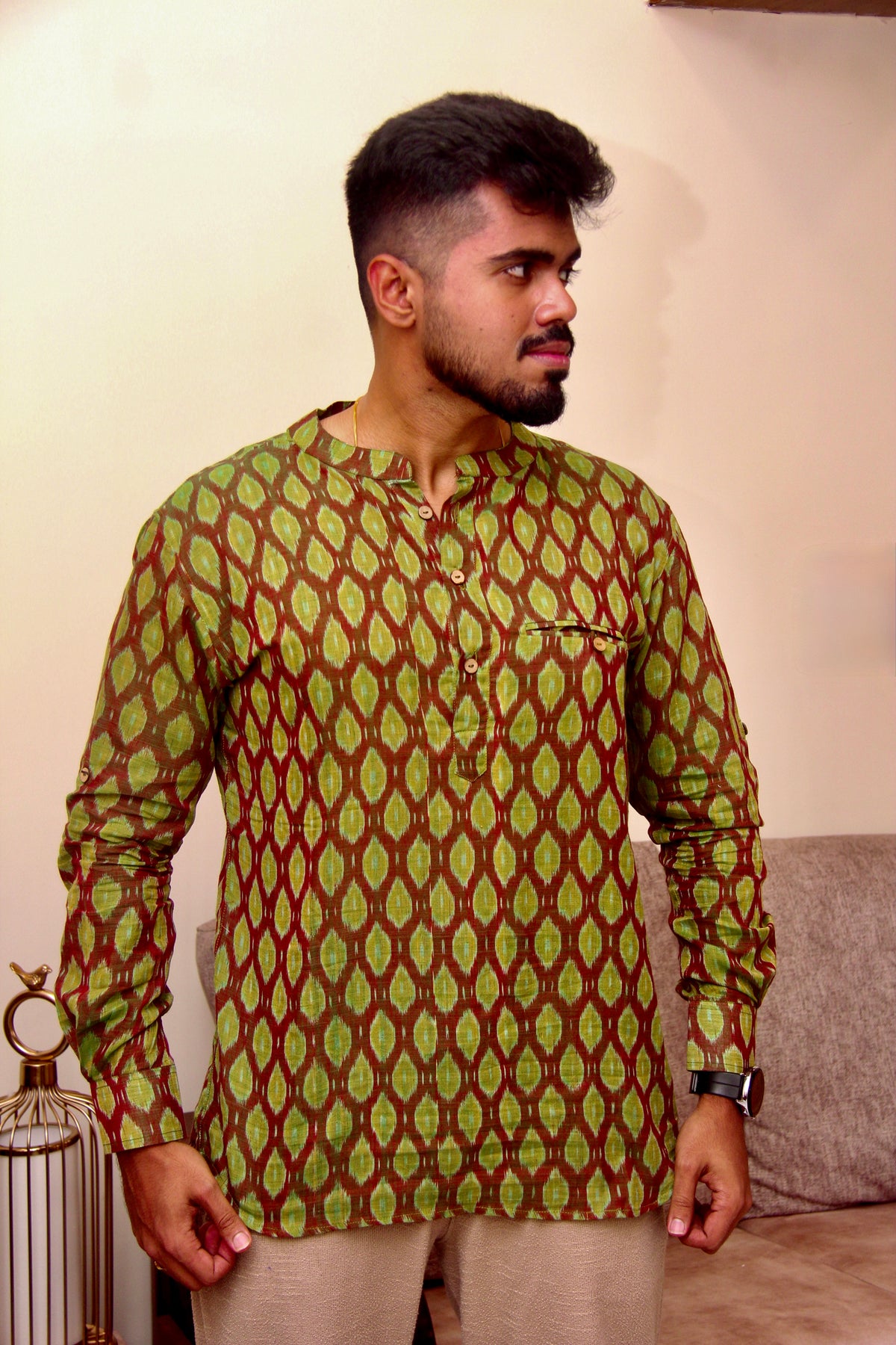 Aam Panna olive green Sambalpuri ikat handloom kurta for men worn with beige trousers, full length