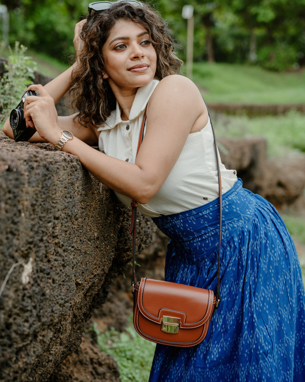 Avani blue Nuapatna handloom corset skirt, three-quarter view with a leather bag