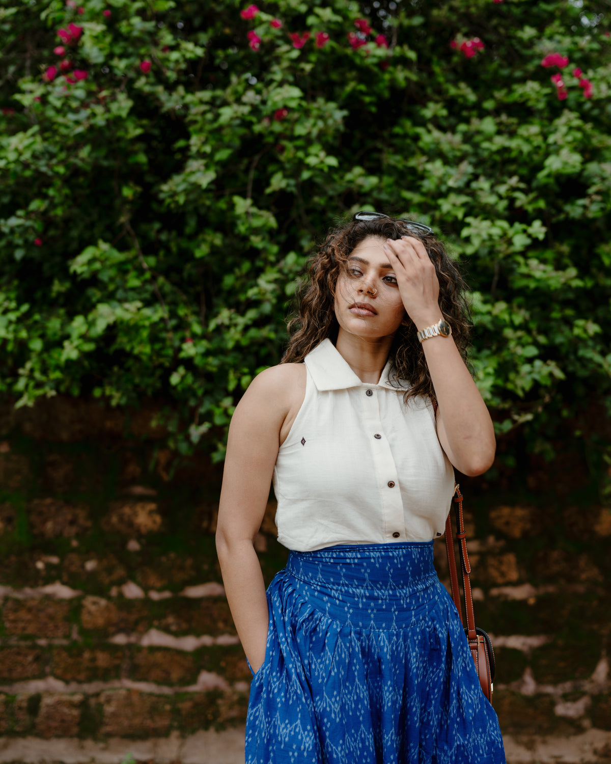 Baisali cream Kotpad handloom cotton top styled with the Avani blue handloom skirt