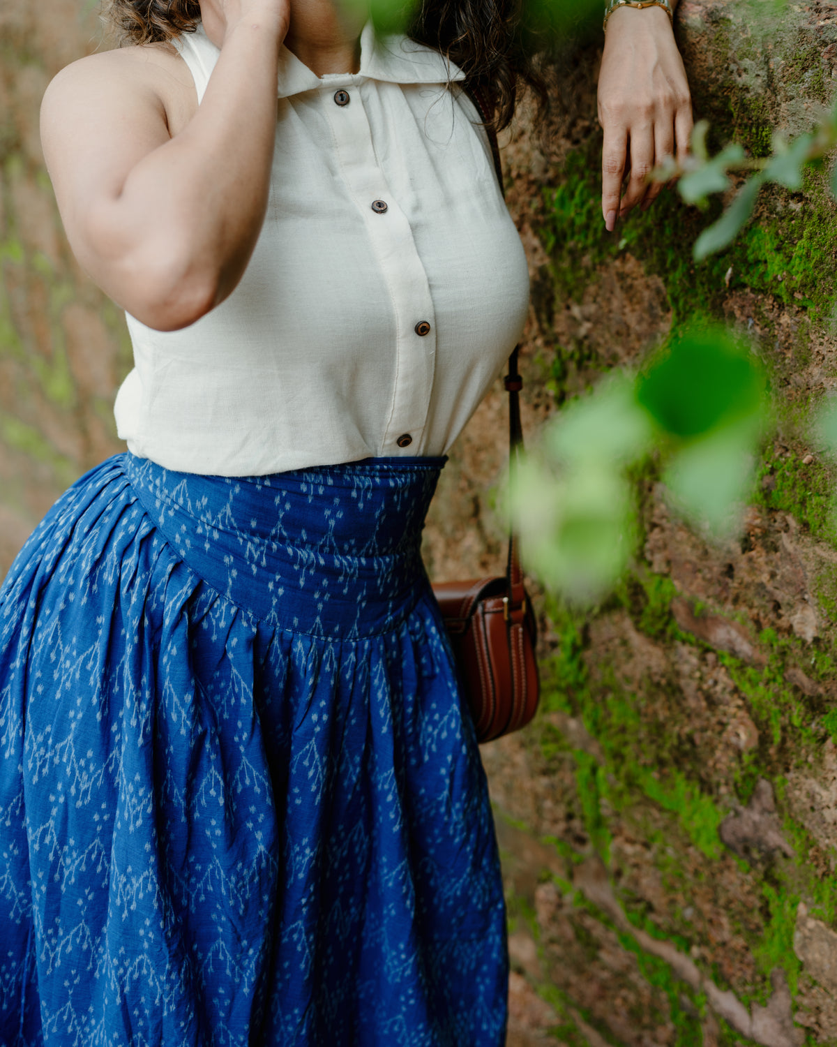 Baisali cream Kotpad handloom cotton top, back view styled with a blue handloom skirt